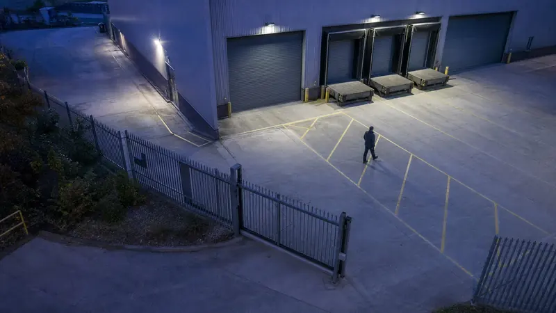 Person crossing an industrial loading bay